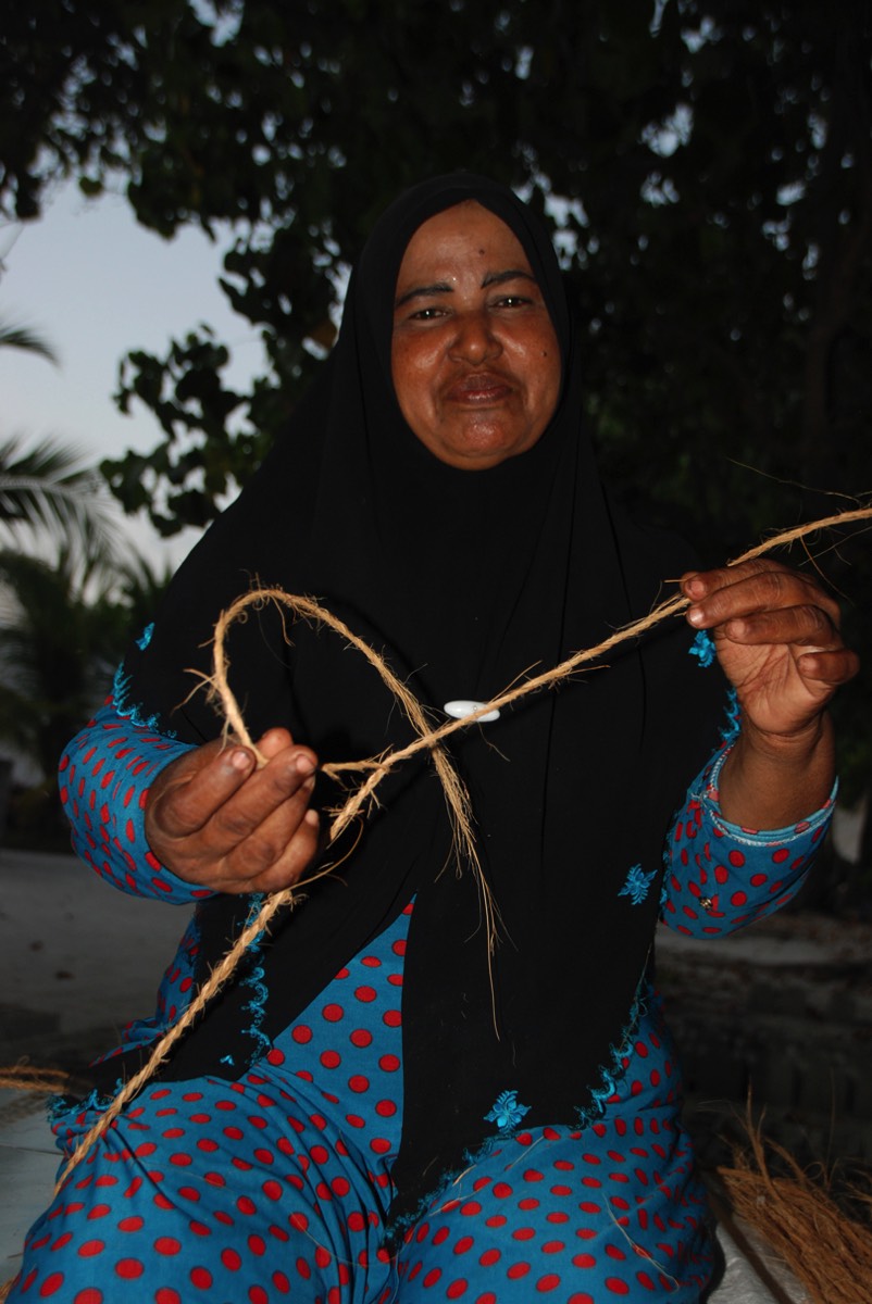 Boutique Beach Maldives local woman doing weaving