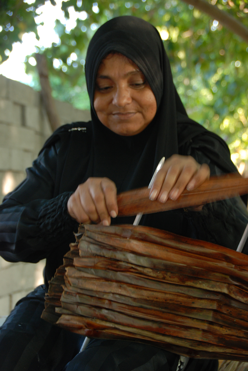 Boutique Beach Maldives Local Woman doing Basket Weaving